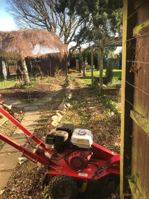 Compact grinder on a garden path