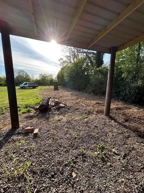 Open ground cleared under a covered area